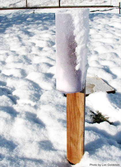 Photo of snow blown in gauge on side