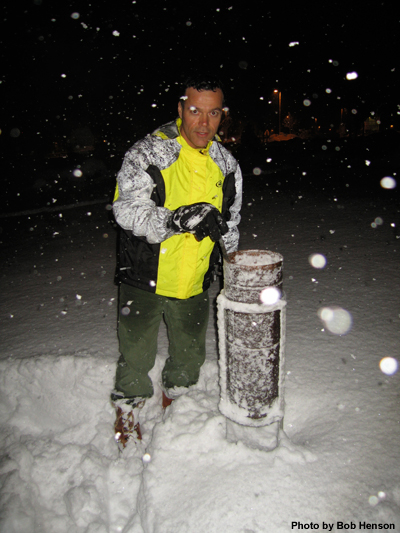 Checking a rain gauge in snow conditions